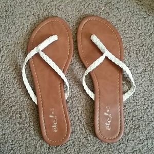 White faux leather flip flops